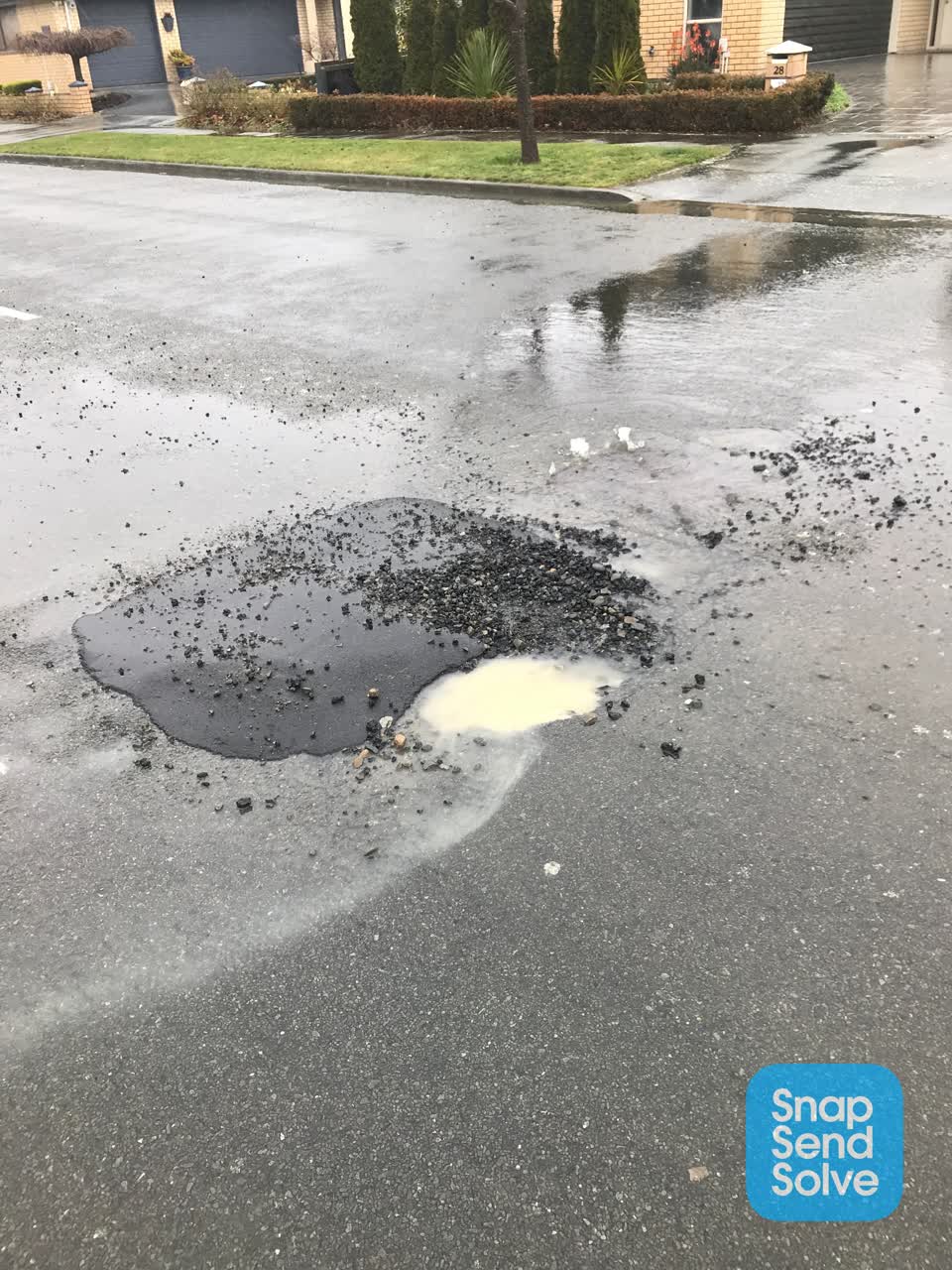 The photograph attached to this pothole report