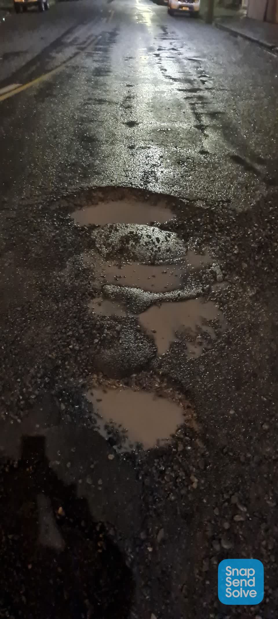 The photograph attached to this pothole report