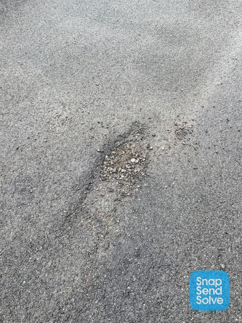 Pothole — a report photo