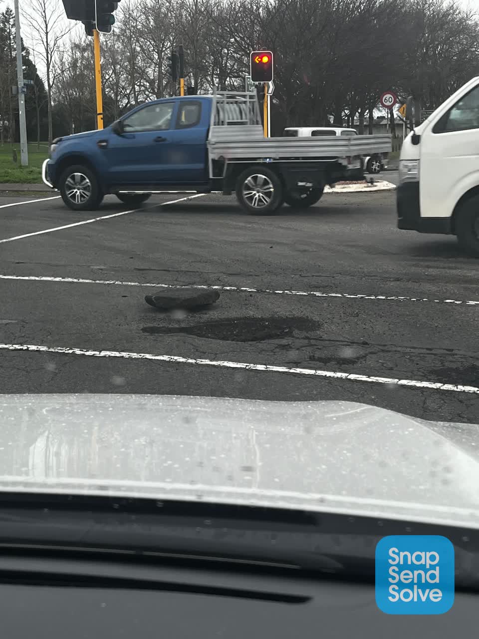 The photograph attached to this damaged road report