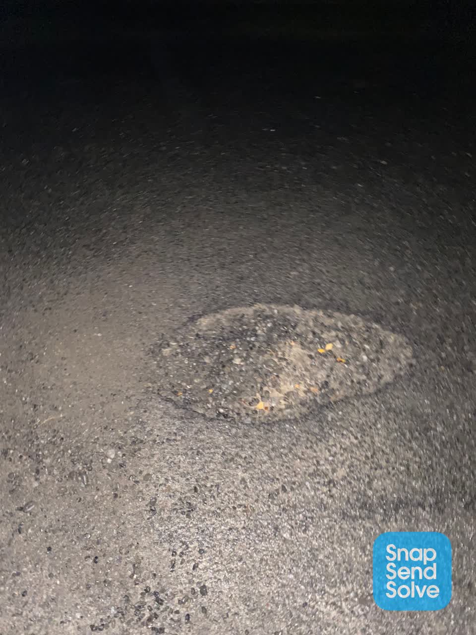 The photograph attached to this damaged road report