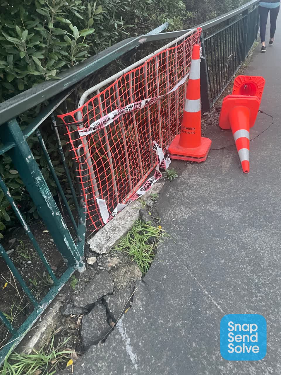 The photograph attached to this pavement - damaged report