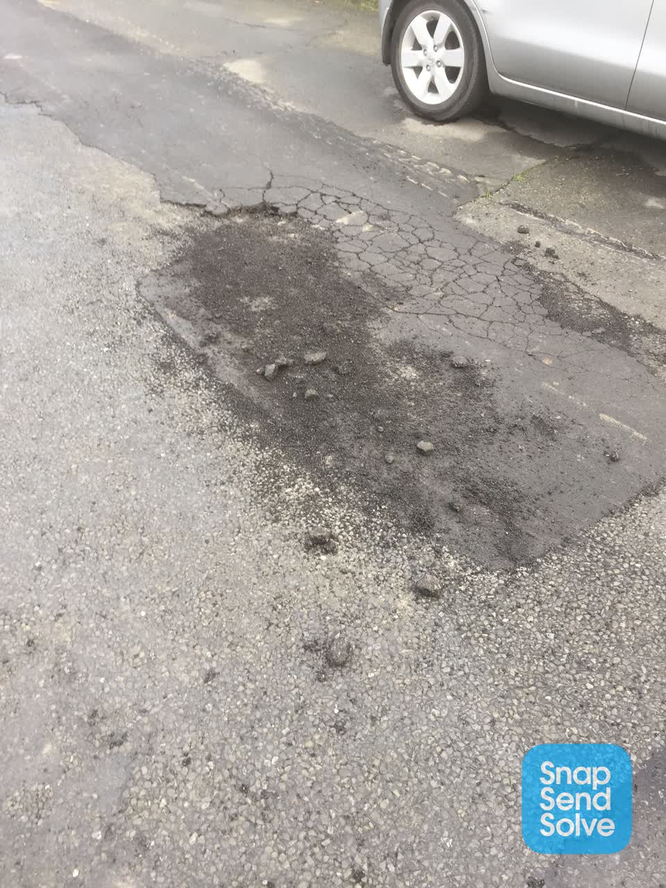 The photograph attached to this damaged road report
