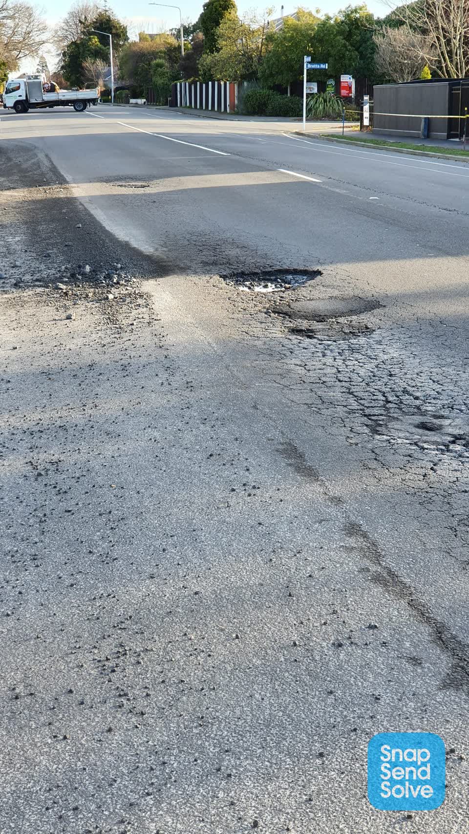 The photograph attached to this pavement - damaged report