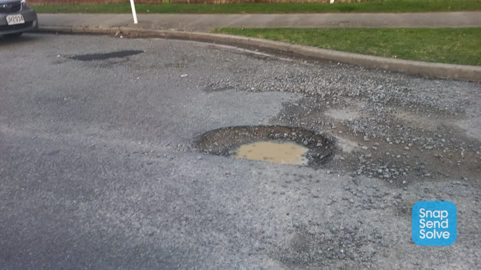 The photograph attached to this pothole report