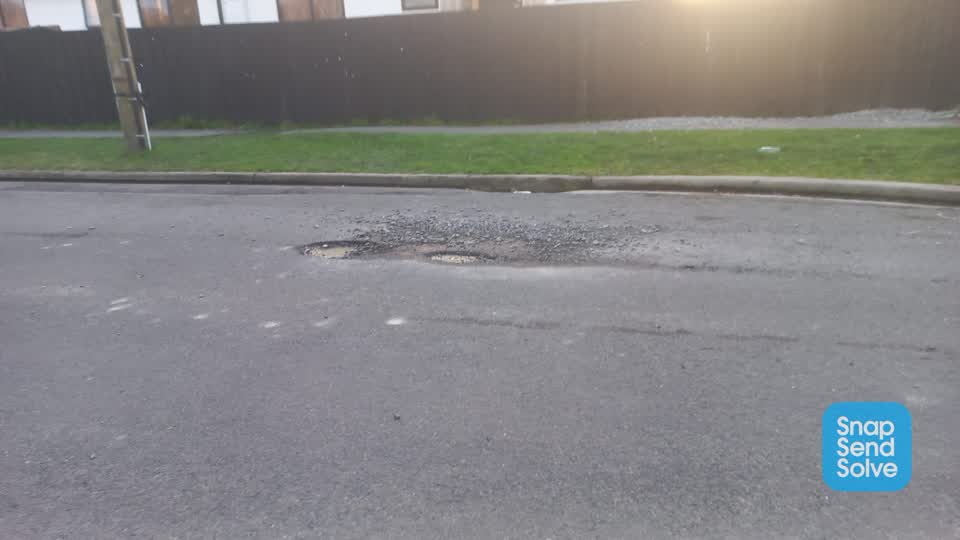 The photograph attached to this pothole report
