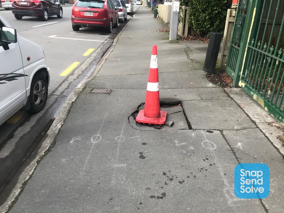 The photograph attached to this pavement - damaged report