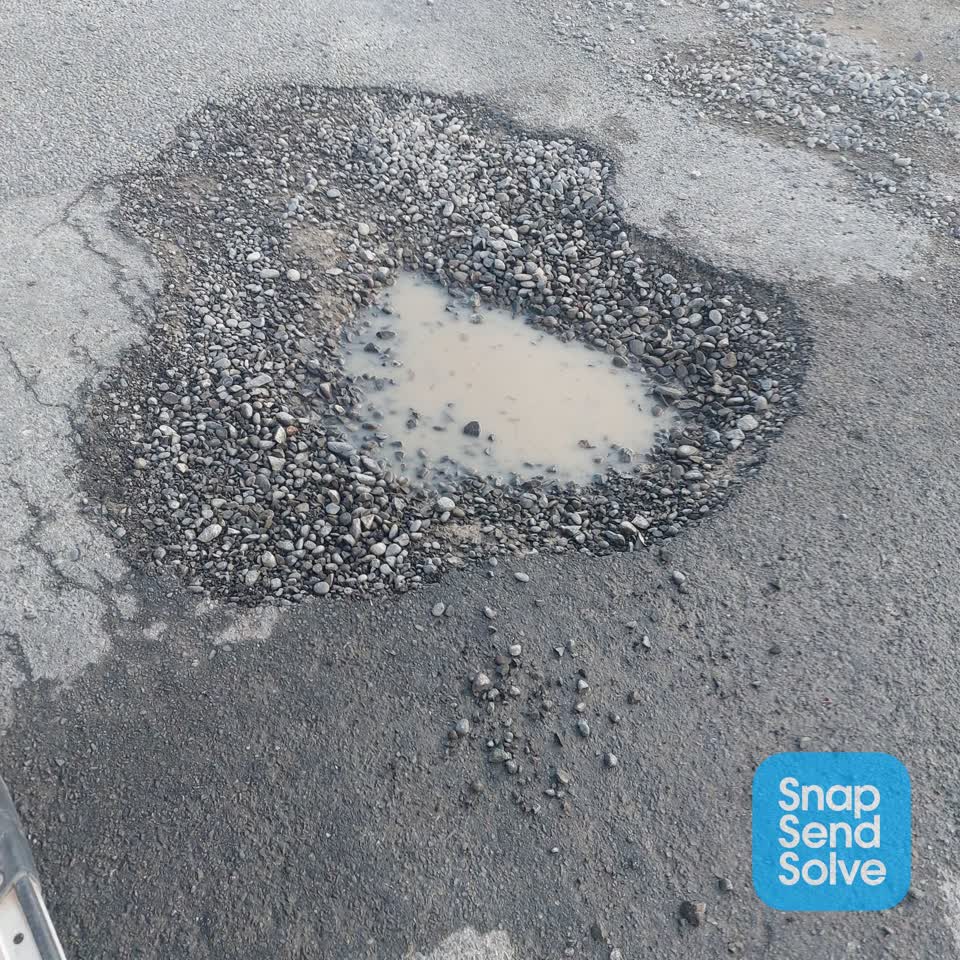 The photograph attached to this damaged road report
