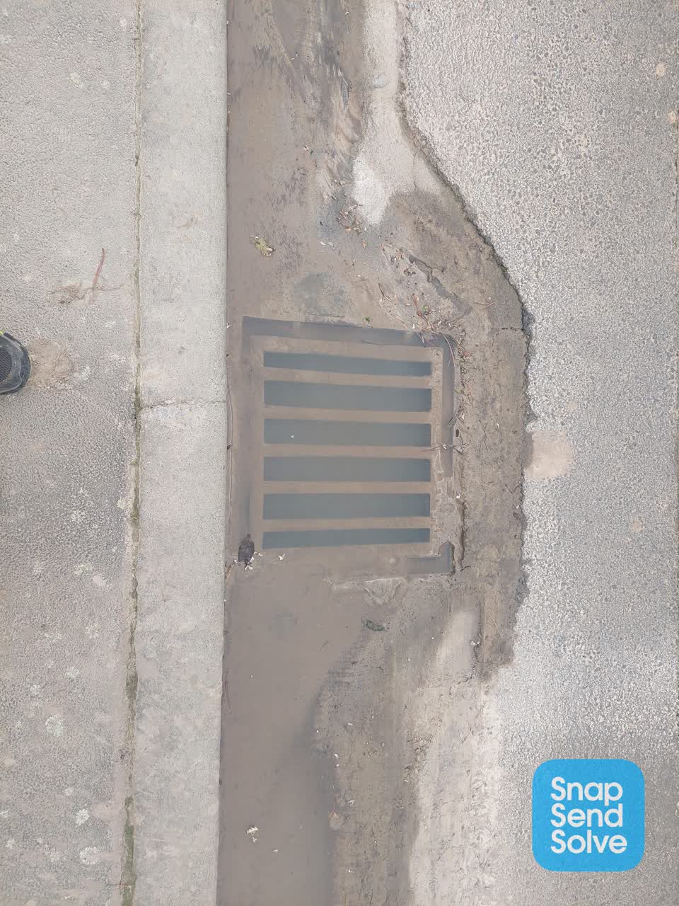 The photograph attached to this street gutters / storm water report