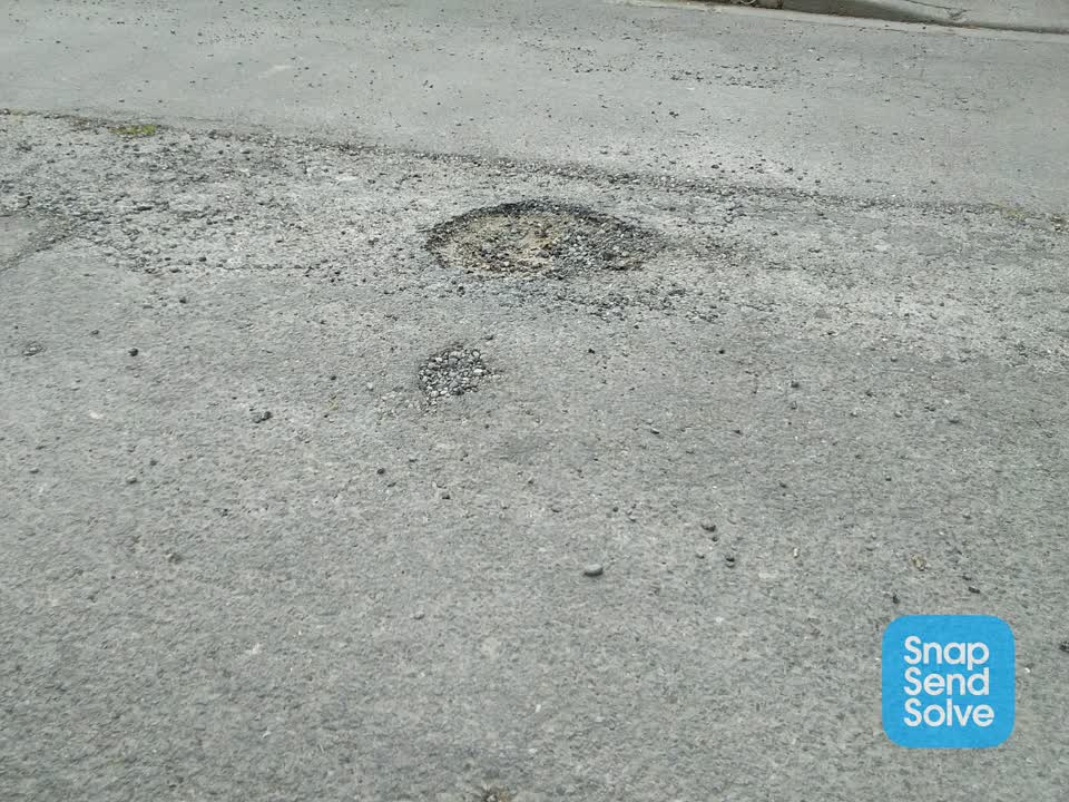 The photograph attached to this damaged road report