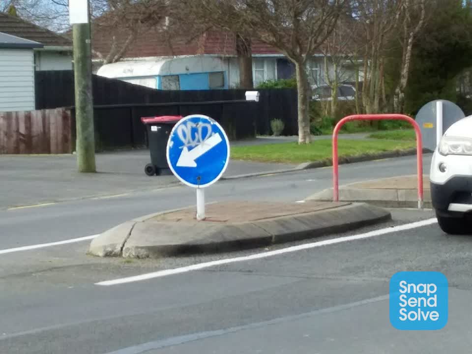 The photograph attached to this damaged street sign report