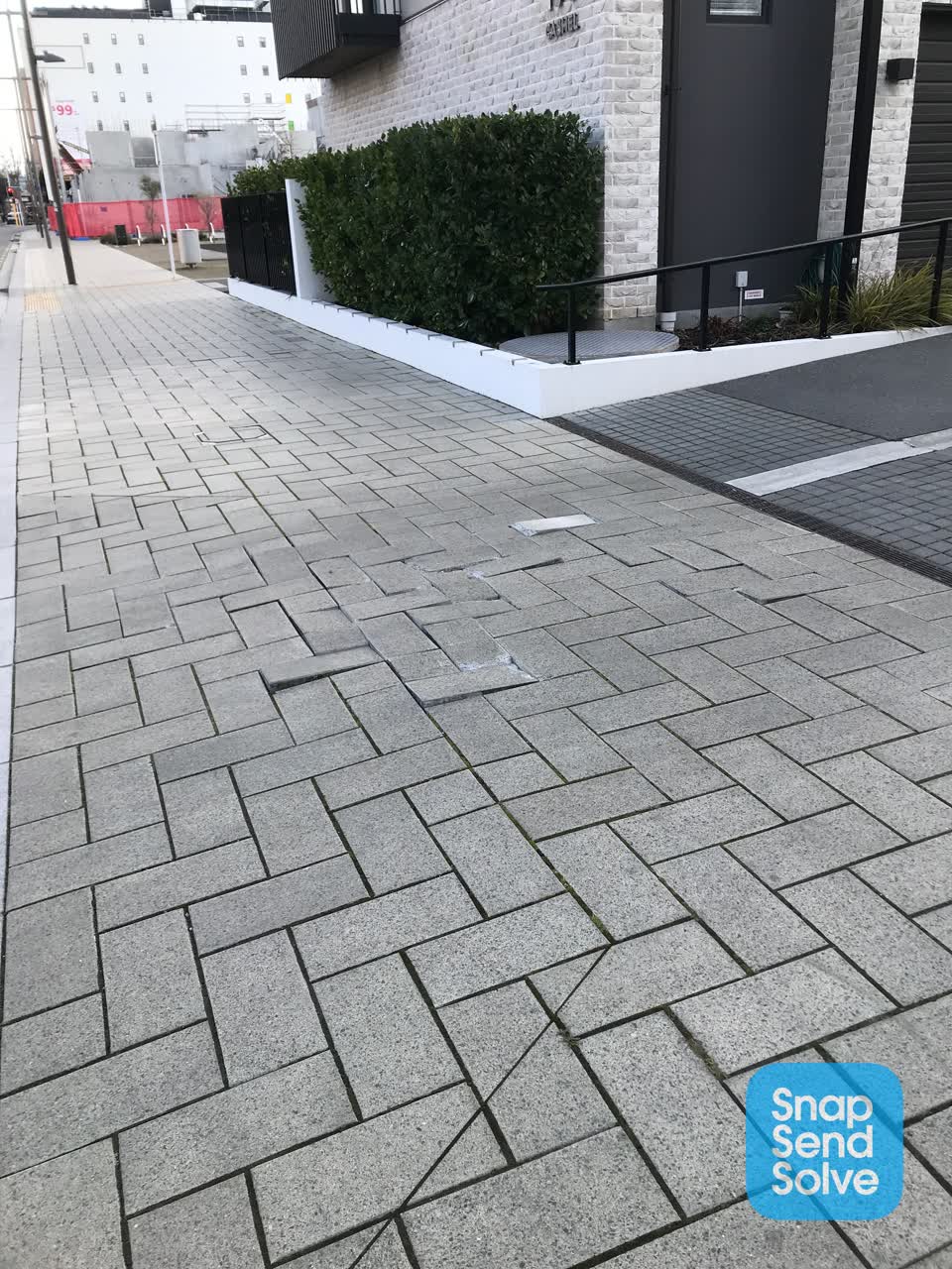 The photograph attached to this pavement - damaged report
