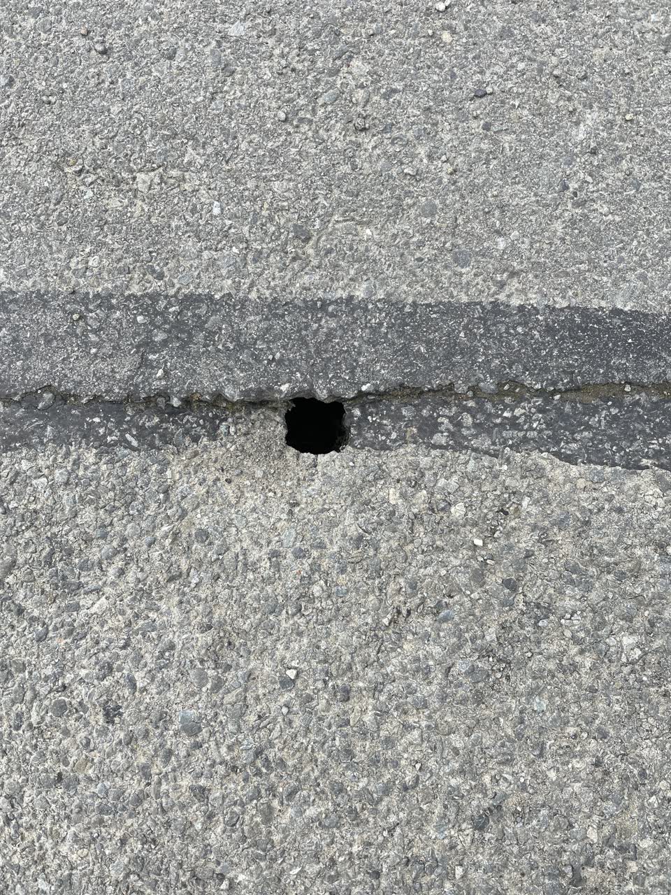 The photograph attached to this pothole report