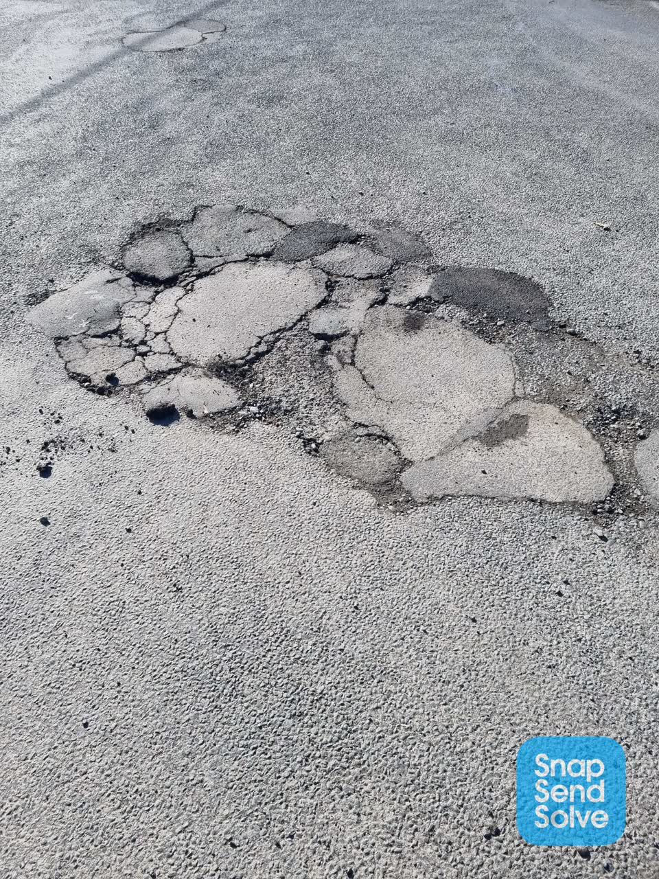 The photograph attached to this damaged road report