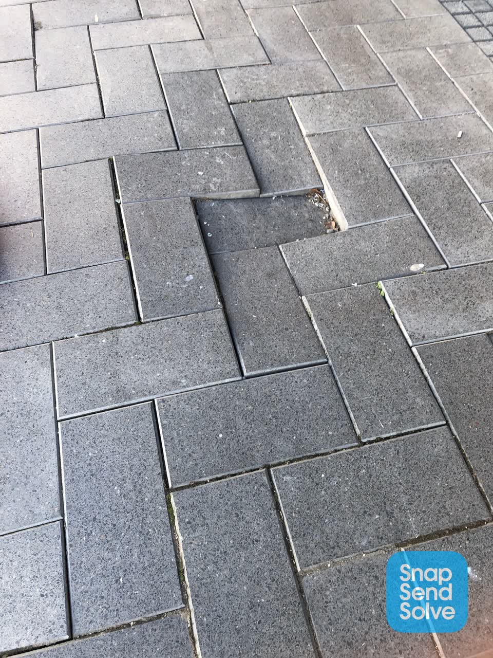 The photograph attached to this pavement - damaged report