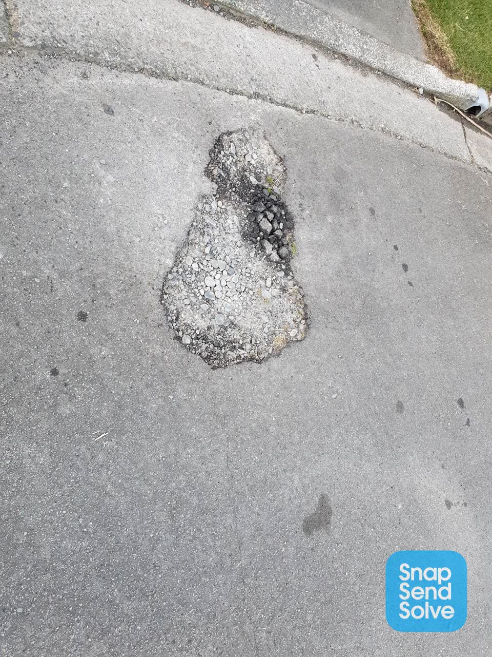 The photograph attached to this pothole report