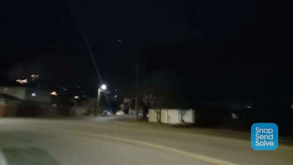 The photograph attached to this street light outage report