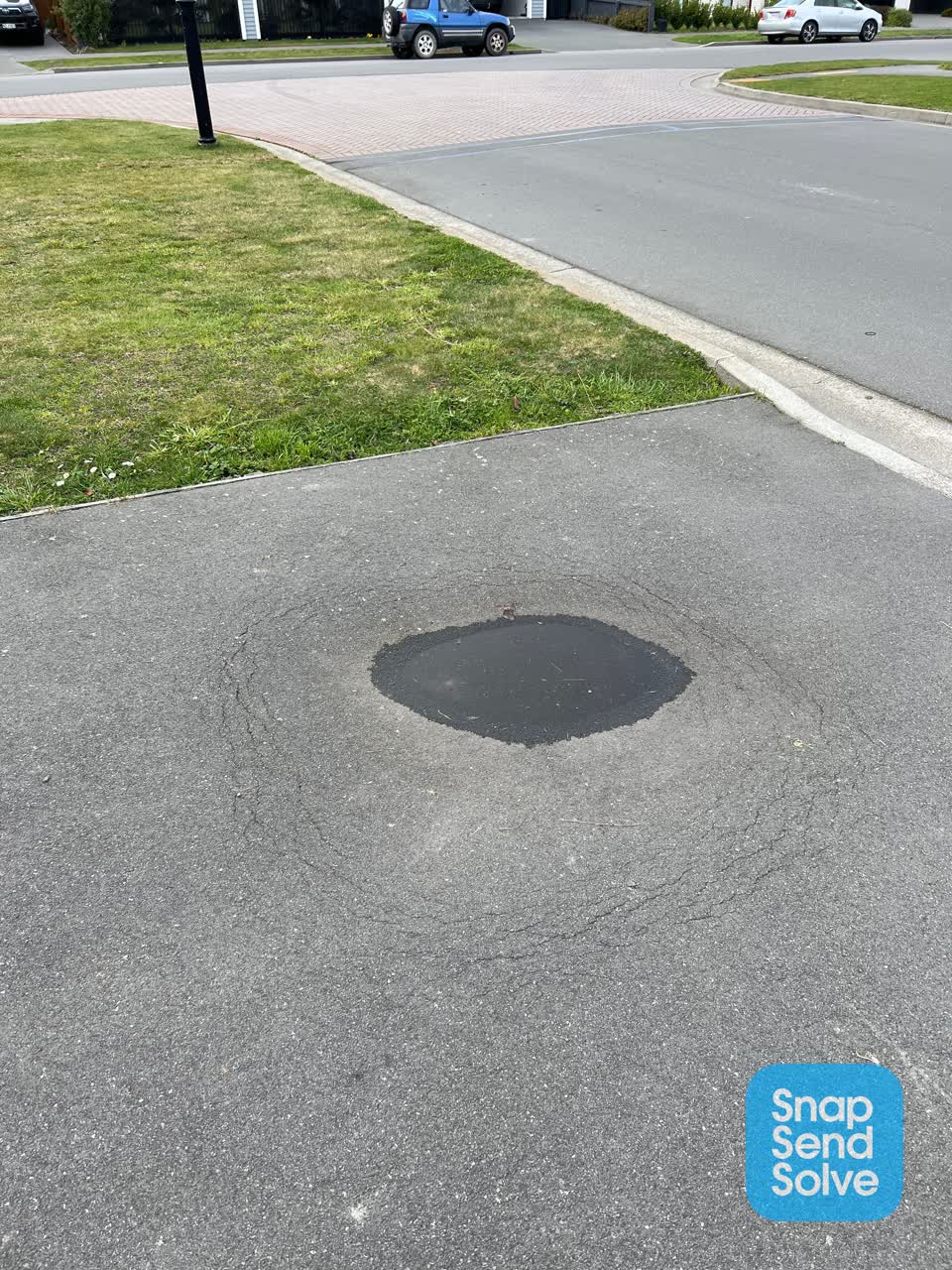 The photograph attached to this pavement - damaged report