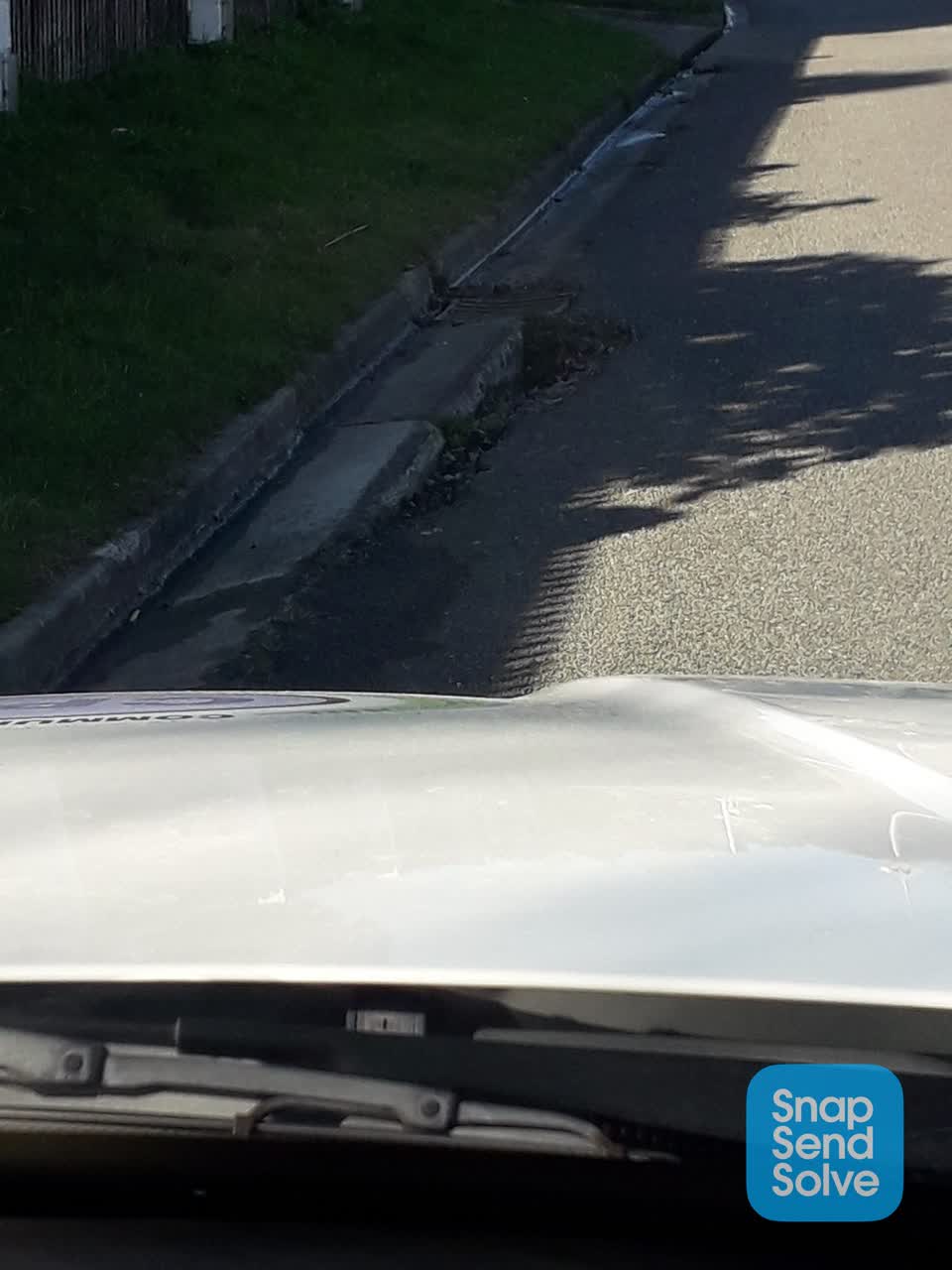 The photograph attached to this damaged road report