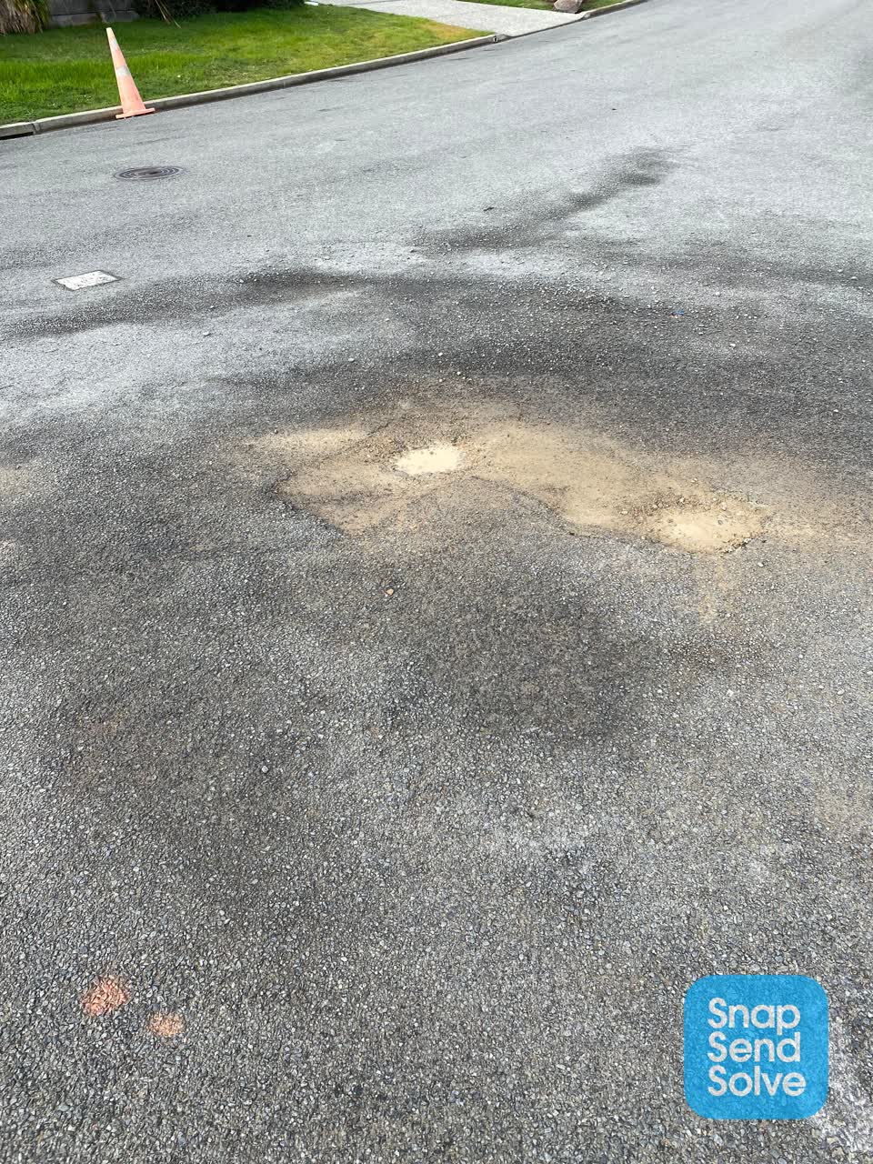 The photograph attached to this damaged road report