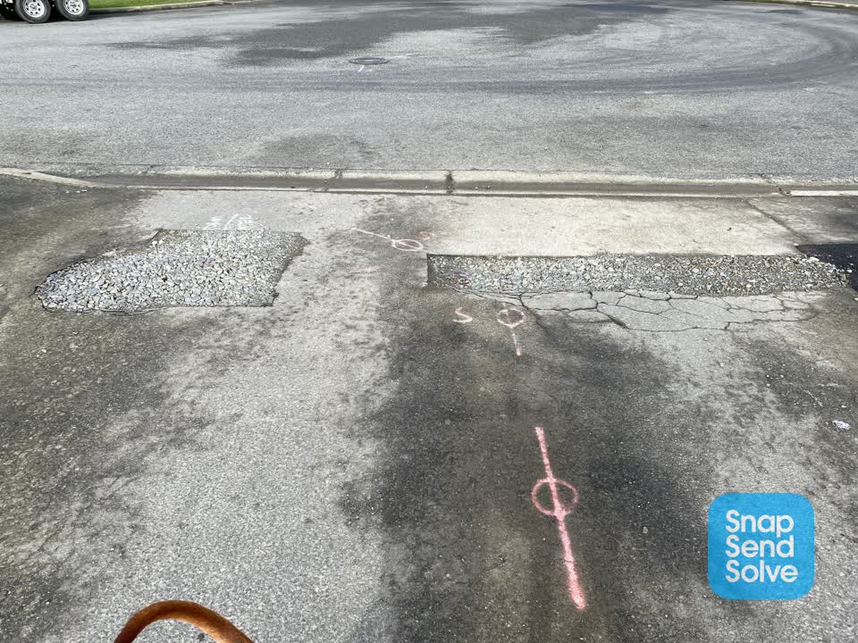 The photograph attached to this pavement - damaged report