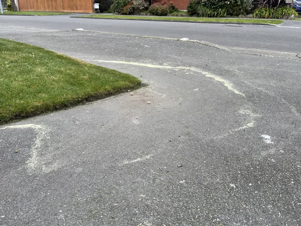 The photograph attached to this pavement - damaged report