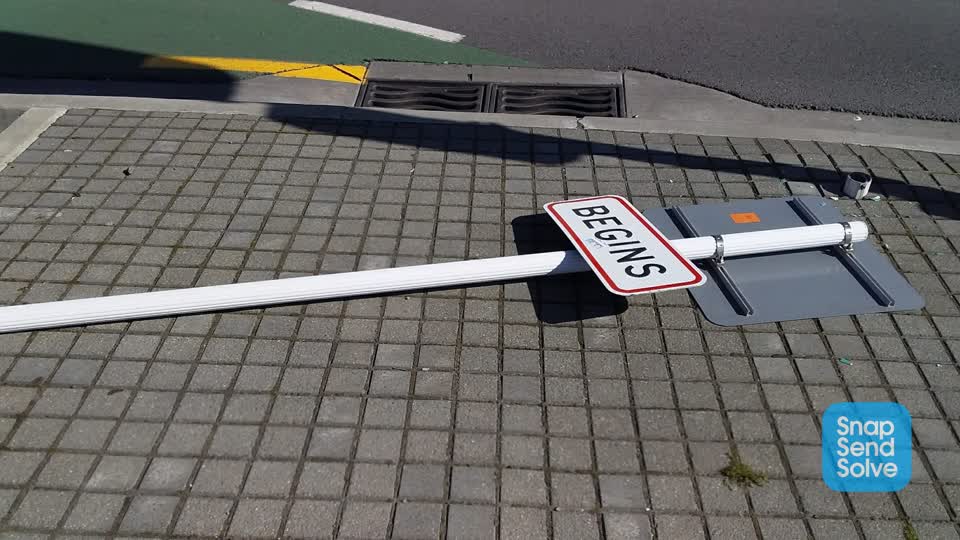 The photograph attached to this damaged street sign report