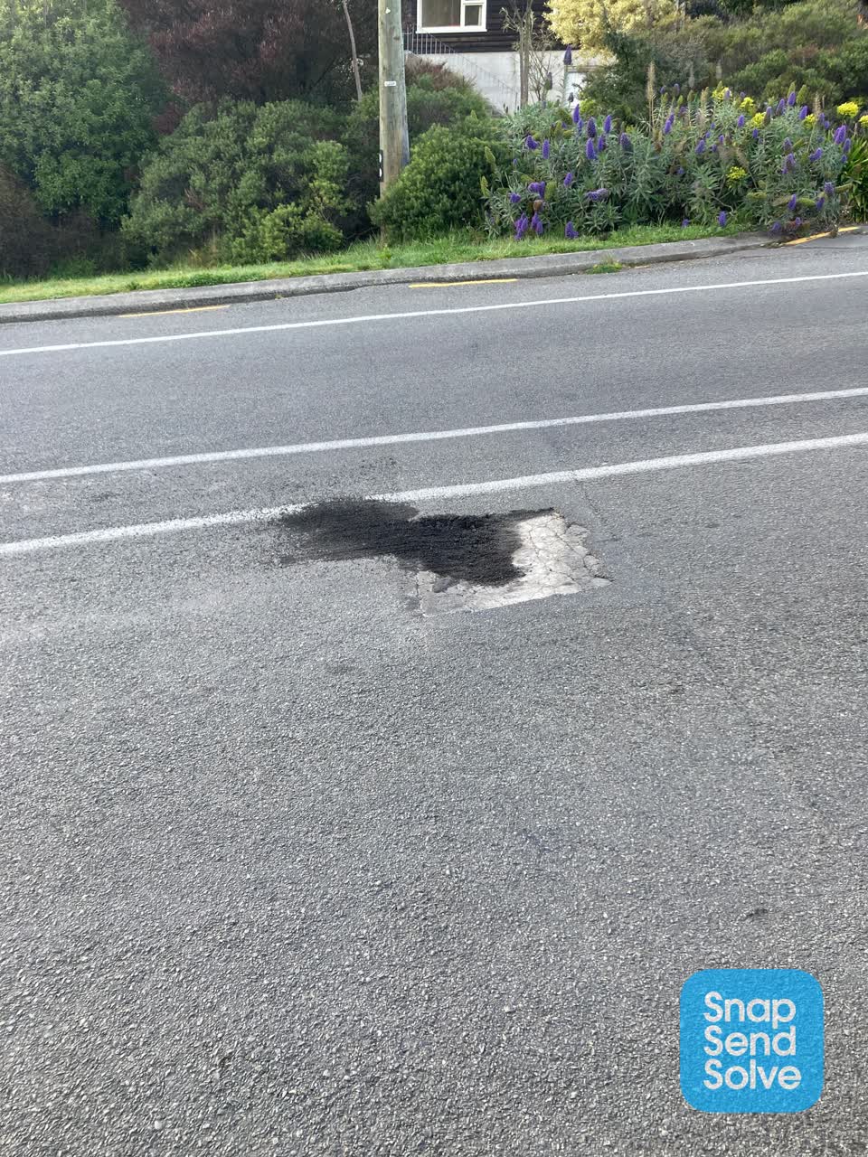 The photograph attached to this pothole report