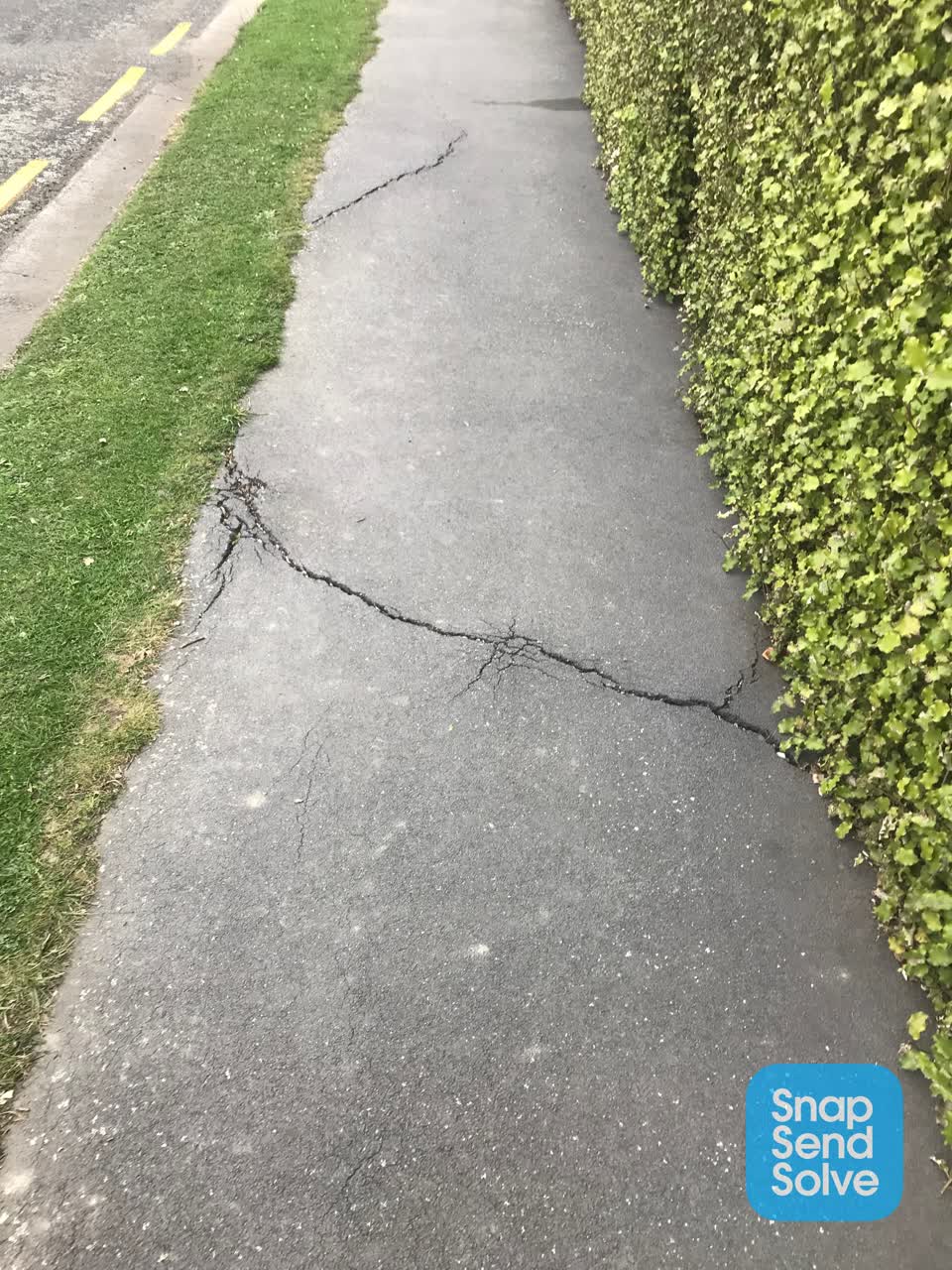 The photograph attached to this pavement - damaged report