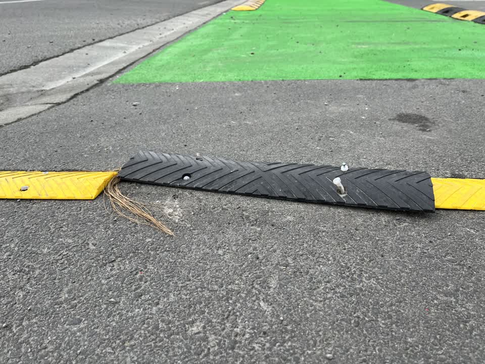 The photograph attached to this pavement - damaged report