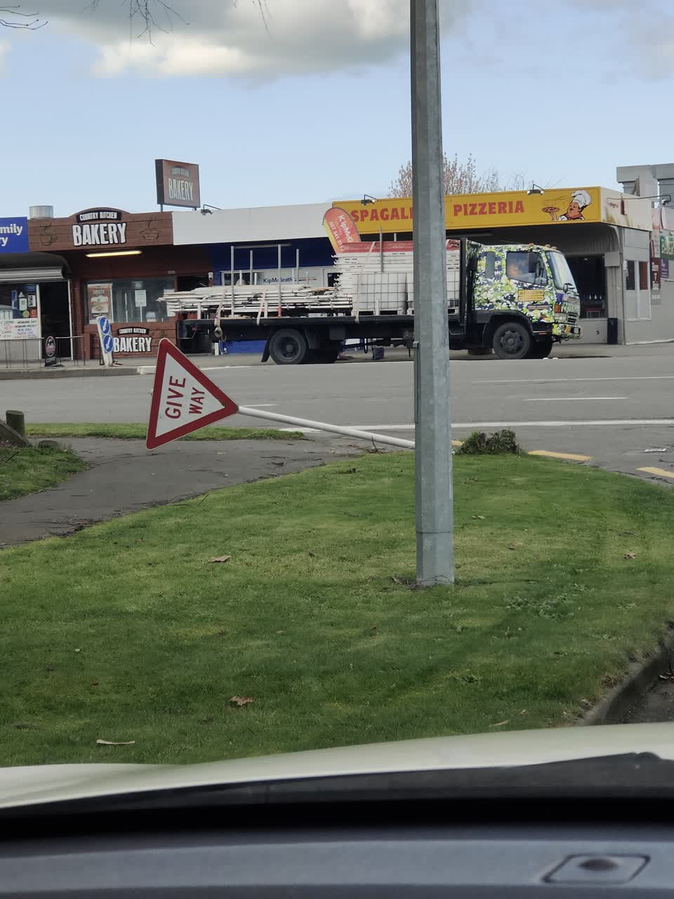 The photograph attached to this damaged street sign report