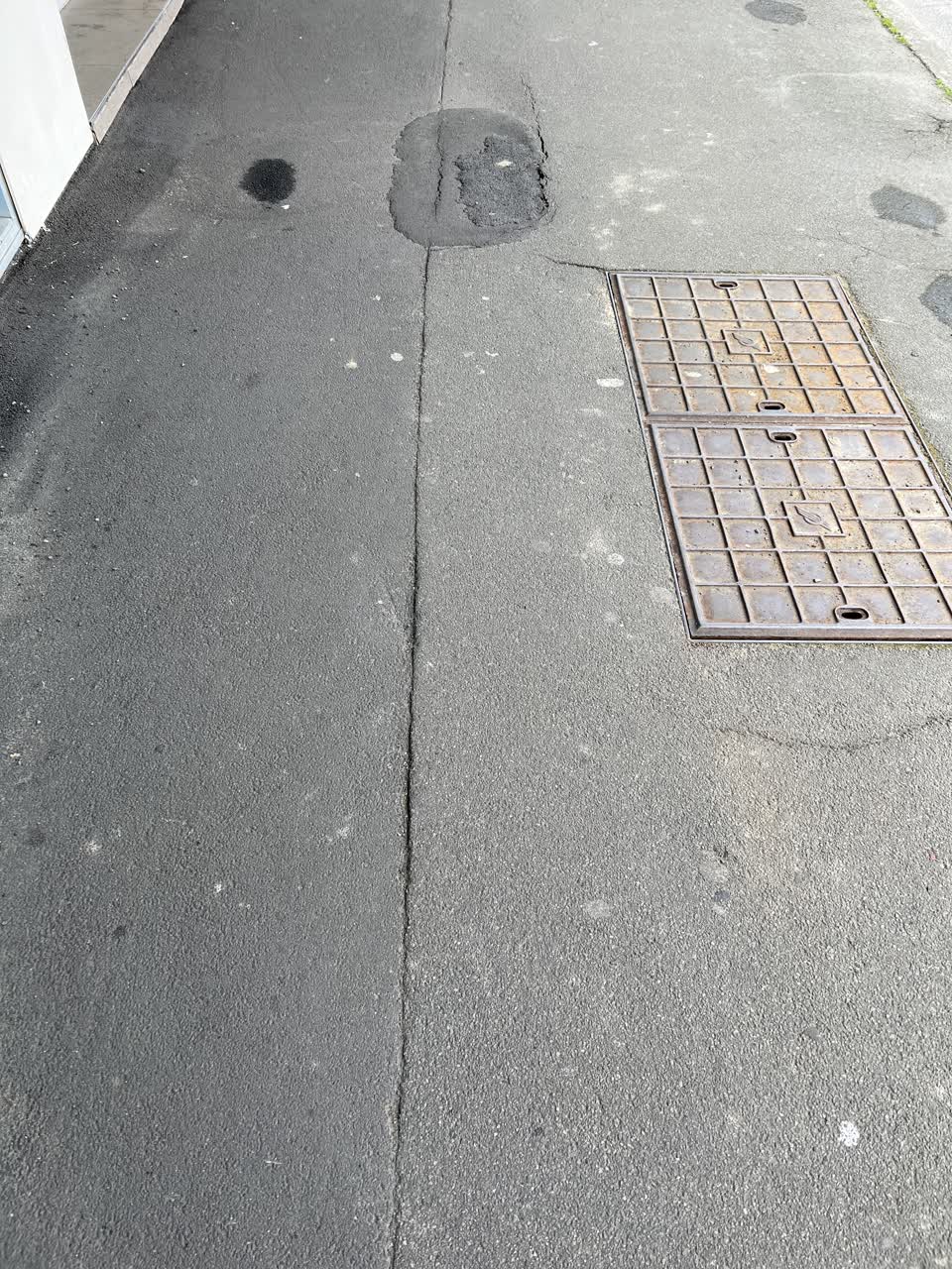 The photograph attached to this pavement - damaged report