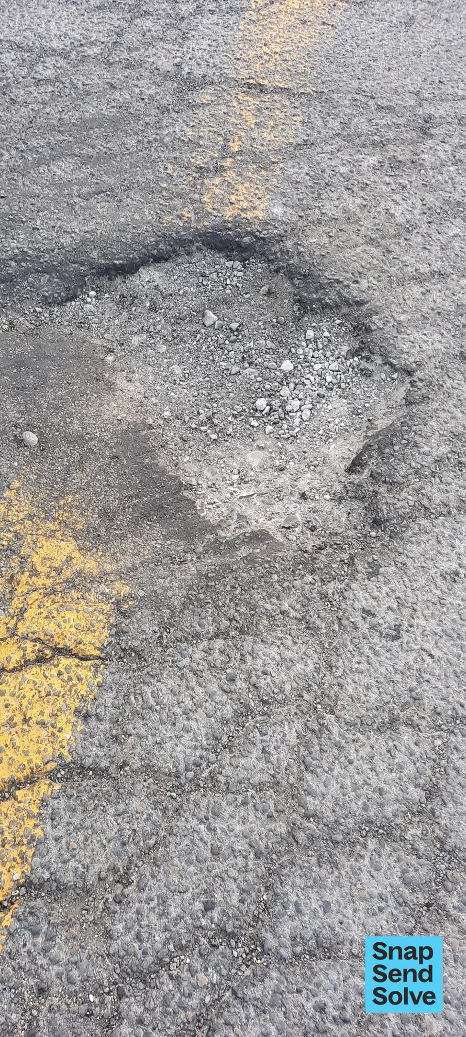 The photograph attached to this pothole report