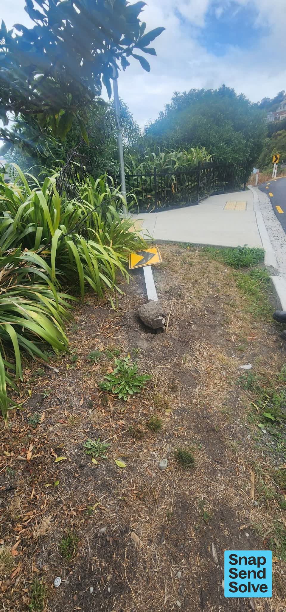 The photograph attached to this damaged street sign report