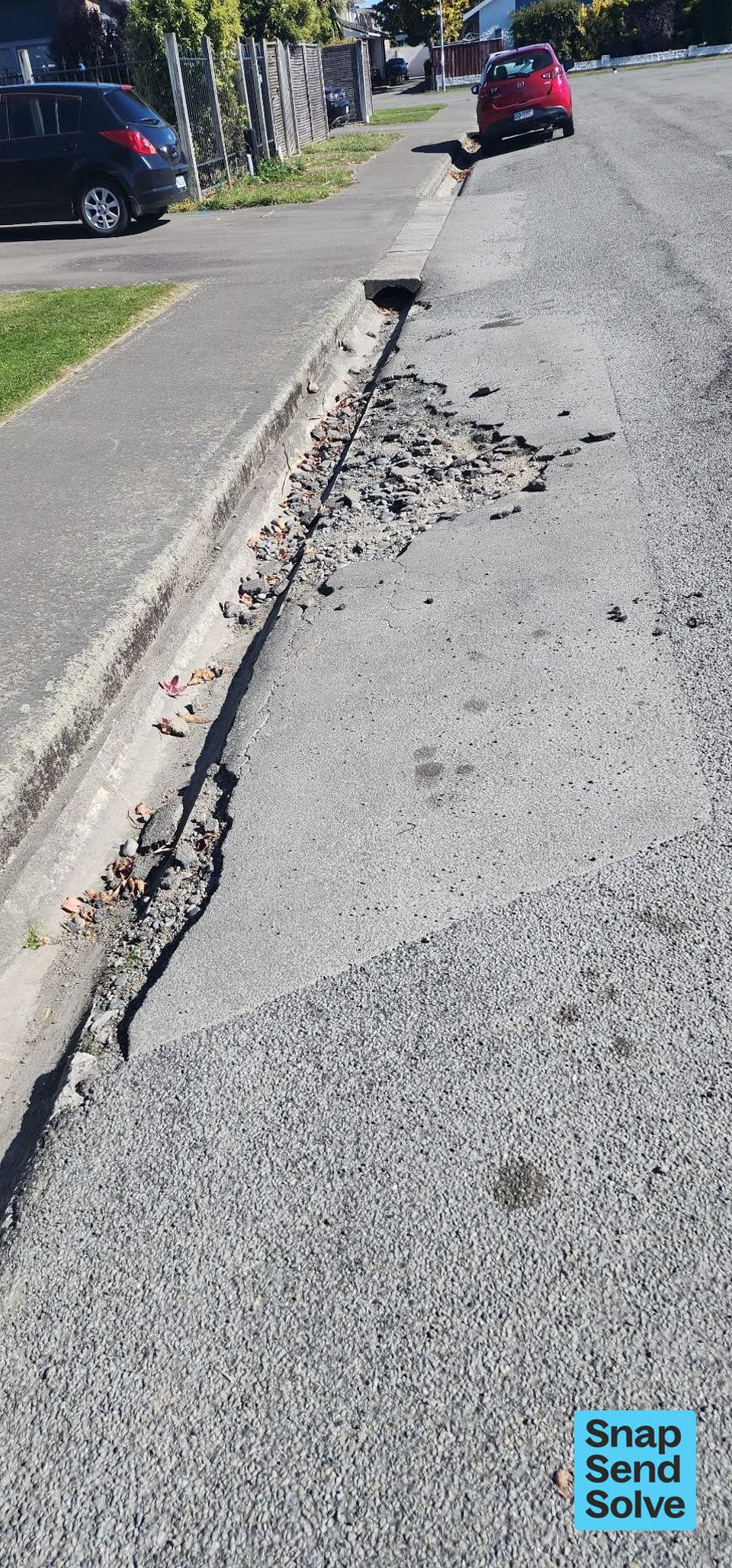 The photograph attached to this damaged road report