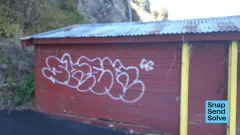 Graffiti on a fence, building or structure, a report photo