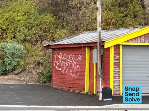 Graffiti on a fence, building or structure, a report photo