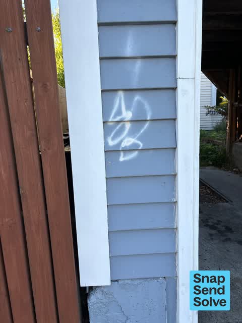 Graffiti on a fence, building or structure, a report photo