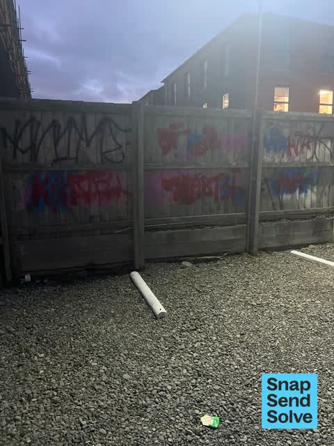 Graffiti on a fence, building or structure, a report photo