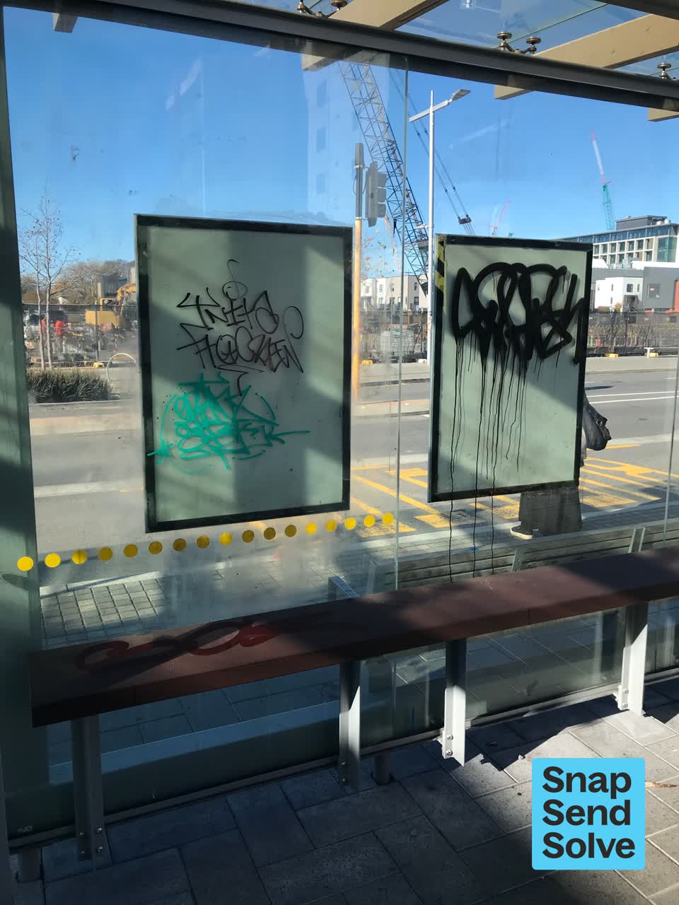 The photograph attached to this graffiti on a bus stop or public toilet report