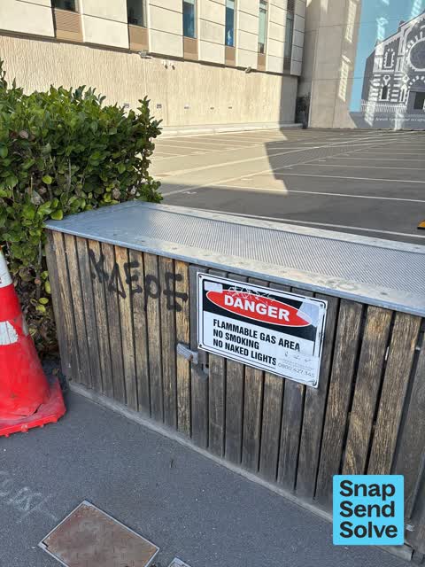 Graffiti on a fence, building or structure, a report photo