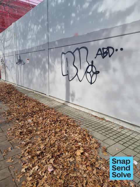 Graffiti on a fence, building or structure — a report photo
