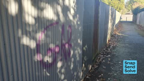 Graffiti on a fence, building or structure, a report photo