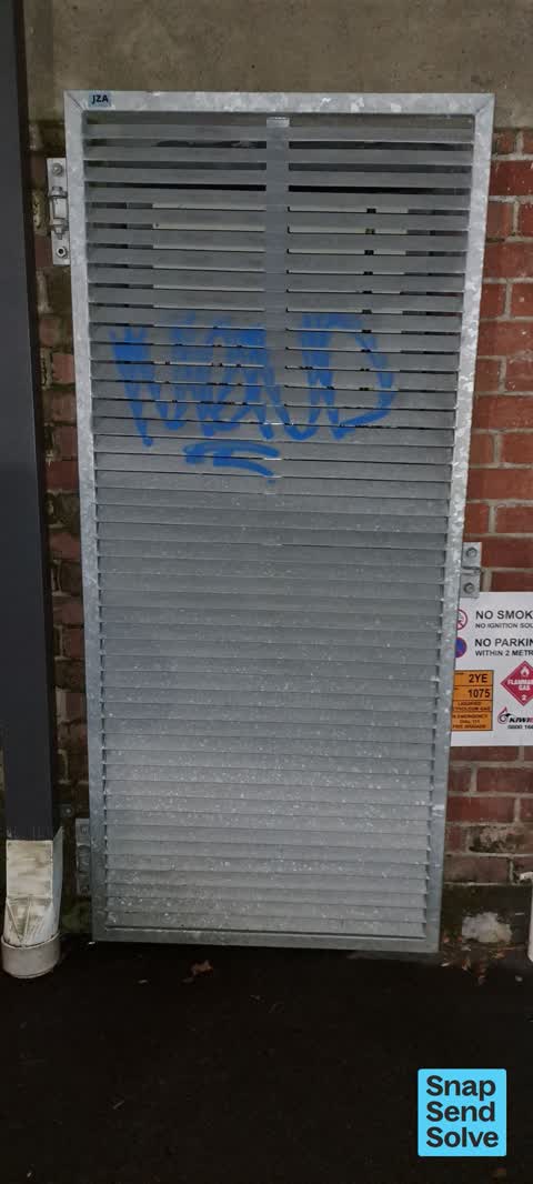 Graffiti on a fence, building or structure, a report photo