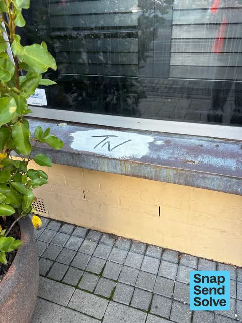 Graffiti on a fence, building or structure, a report photo