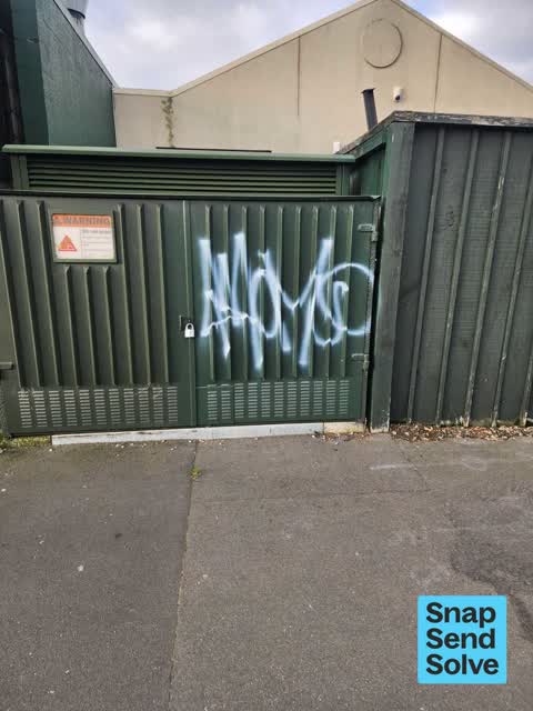 Graffiti on a fence, building or structure, a report photo