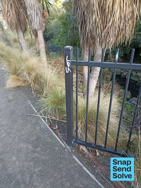 Graffiti on a fence, building or structure, a report photo