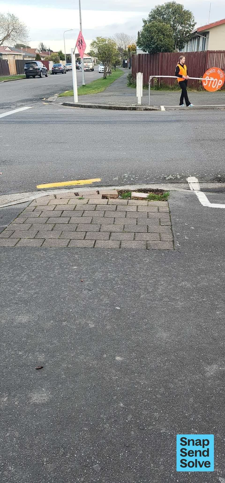 The photograph attached to this pavement - damaged report