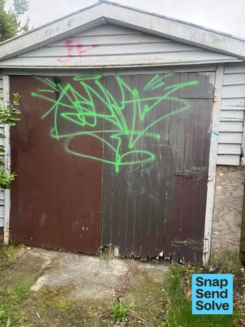 Graffiti on a fence, building or structure — a report photo