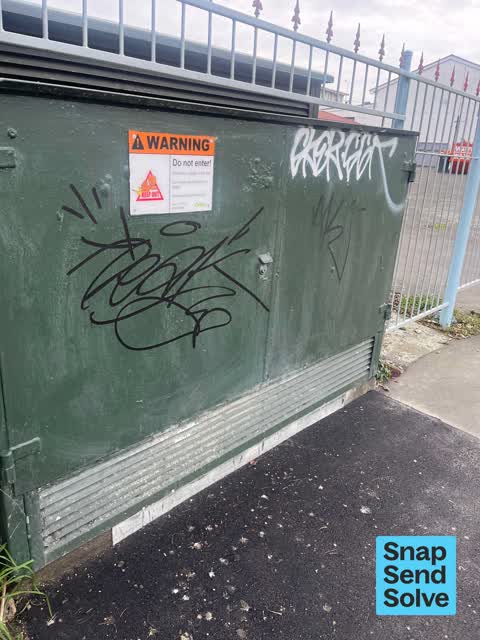 Graffiti on a fence, building or structure — a report photo